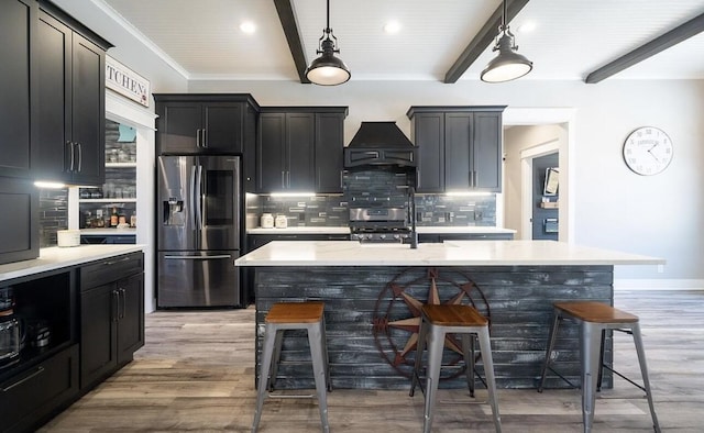 8477 84th St SE, Alto, MI 49302 - kitchen featuring stainless steel appliances, beam ceiling, a kitchen bar, tasteful backsplash, and custom range hood