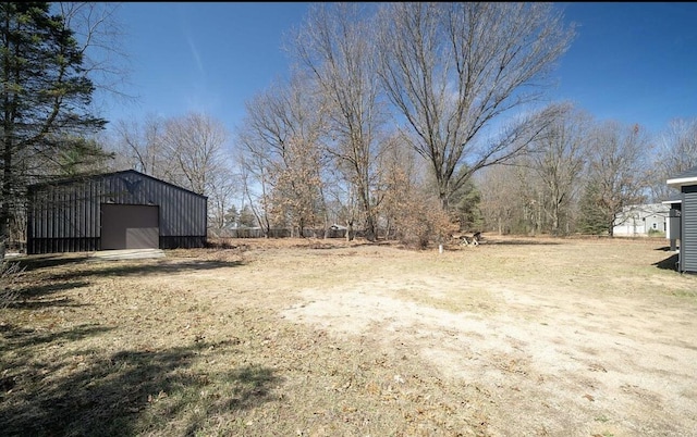 8477 84th St SE, Alto, MI 49302 - view of yard with an outdoor structure and a garage