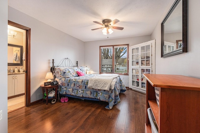 66100 Dolans Ave, Vandalia, MI 49095 - bedroom with ensuite bathroom, dark wood-style floors, and a ceiling fan