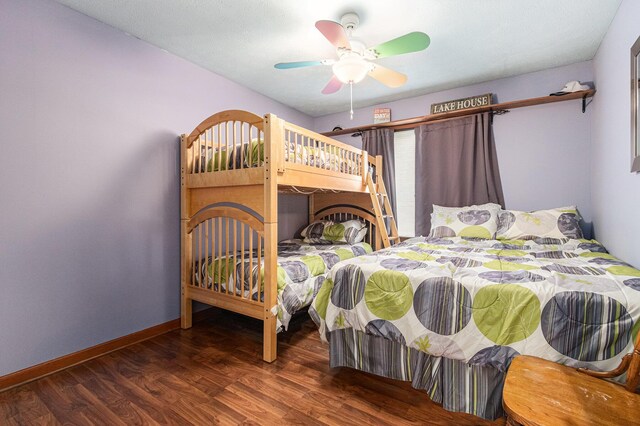 66100 Dolans Ave, Vandalia, MI 49095 - bedroom featuring baseboards, a ceiling fan, and wood finished floors
