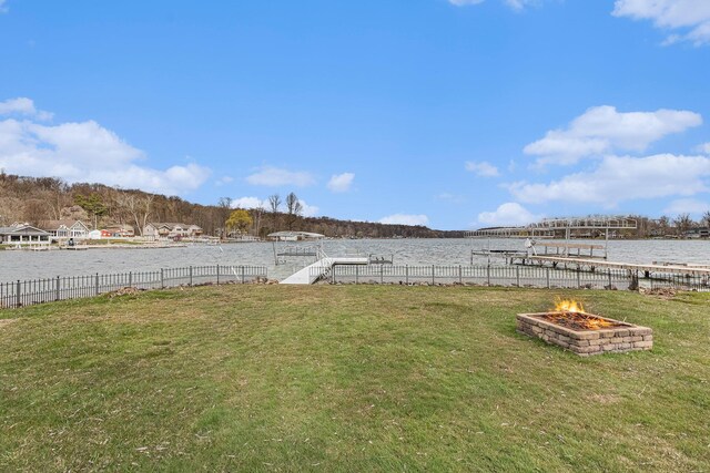 66100 Dolans Ave, Vandalia, MI 49095 - view of yard with fence, a boat dock, an outdoor fire pit, and a water view