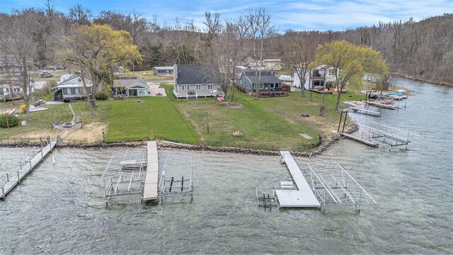 66100 Dolans Ave, Vandalia, MI 49095 - view of dock featuring a lawn, a view of trees, and a water view