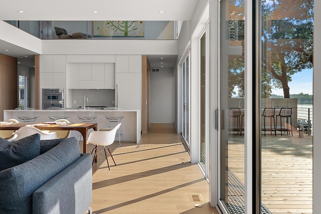 602 Lawn Ave, Holland, MI 49424 - interior space featuring recessed lighting, light wood-style flooring, a wealth of natural light, and visible vents
