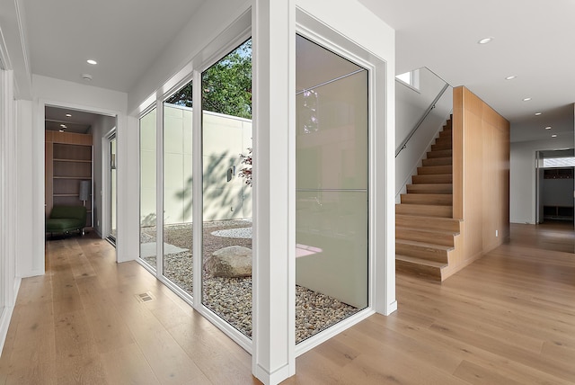 602 Lawn Ave, Holland, MI 49424 - doorway featuring recessed lighting, light wood-style flooring, and stairs
