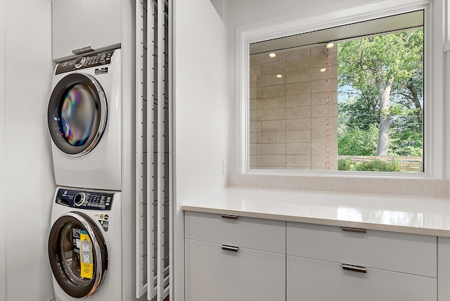 602 Lawn Ave, Holland, MI 49424 - washroom featuring stacked washer / drying machine and laundry area
