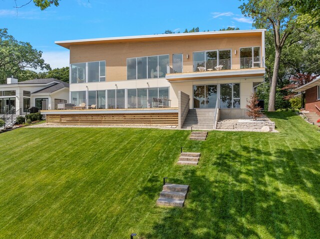 602 Lawn Ave, Holland, MI 49424 - back of house with a lawn and a balcony