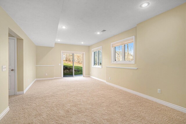 8560 Western Woods Dr, Kalamazoo, MI 49009 - spare room featuring recessed lighting, baseboards, and light colored carpet