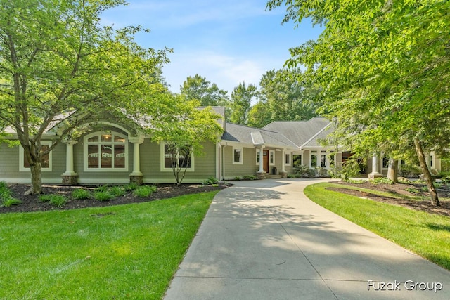 17180 Shore Oaks W Ln, Holland, MI 49424 - view of front facade featuring driveway and a front yard