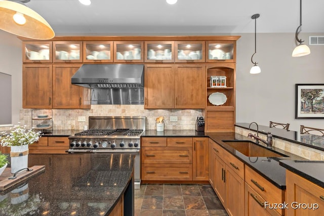 17180 Shore Oaks W Ln, Holland, MI 49424 - kitchen with range hood, decorative backsplash, pendant lighting, brown cabinets, and recessed lighting