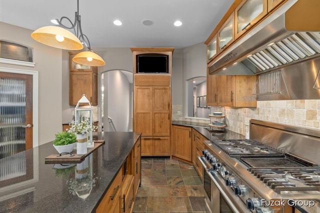 17180 Shore Oaks W Ln, Holland, MI 49424 - kitchen featuring ventilation hood, double oven range, stone finish flooring, decorative backsplash, and brown cabinets
