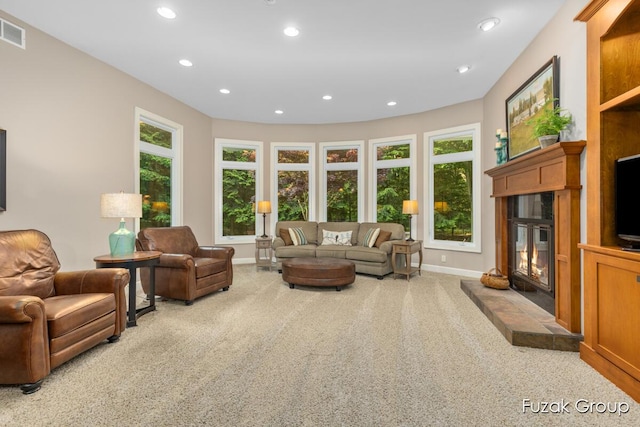17180 Shore Oaks W Ln, Holland, MI 49424 - living area featuring recessed lighting, carpet flooring, and a glass covered fireplace