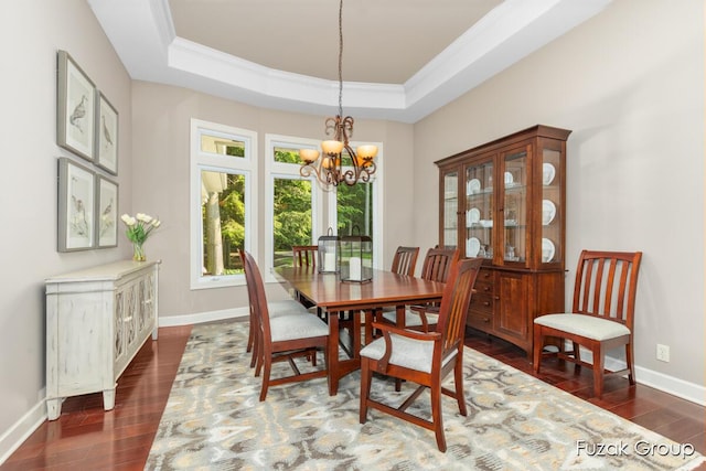 17180 Shore Oaks W Ln, Holland, MI 49424 - dining room with a chandelier, ornamental molding, dark wood finished floors, and a tray ceiling