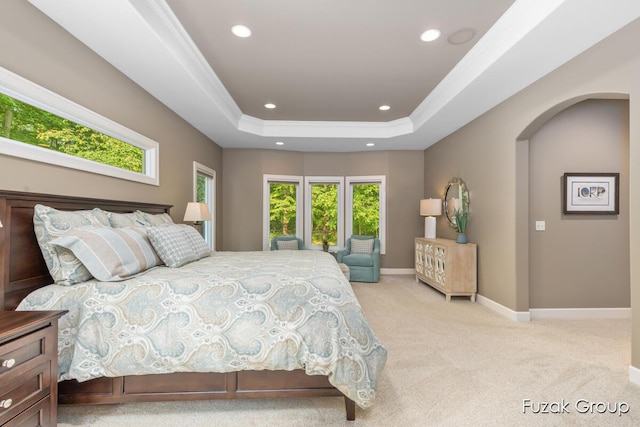 17180 Shore Oaks W Ln, Holland, MI 49424 - bedroom with carpet flooring, recessed lighting, a raised ceiling, arched walkways, and ornamental molding