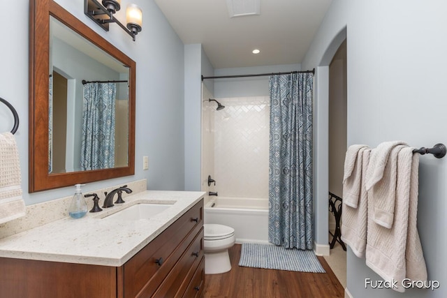 17180 Shore Oaks W Ln, Holland, MI 49424 - bathroom with vanity, wood finished floors, and shower / tub combo