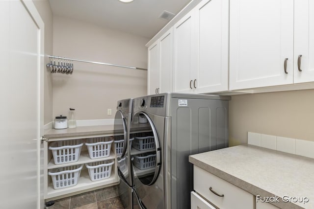 17180 Shore Oaks W Ln, Holland, MI 49424 - laundry area with cabinet space and washing machine and dryer