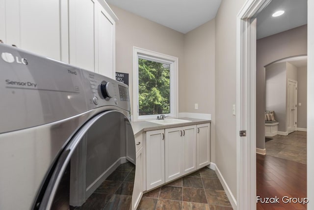 17180 Shore Oaks W Ln, Holland, MI 49424 - washroom with cabinet space and washer / dryer