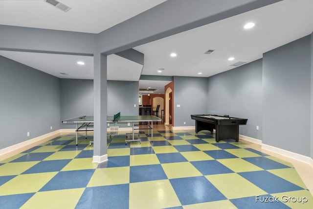 17180 Shore Oaks W Ln, Holland, MI 49424 - rec room featuring arched walkways, tile patterned floors, and recessed lighting