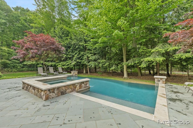 17180 Shore Oaks W Ln, Holland, MI 49424 - view of swimming pool with a patio area and a pool with connected hot tub