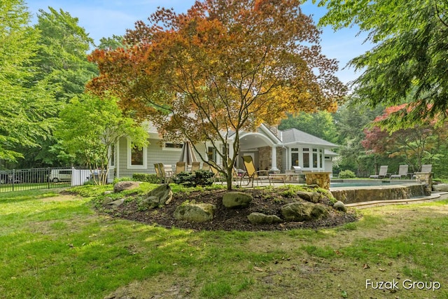 17180 Shore Oaks W Ln, Holland, MI 49424 - back of property featuring a patio area and stone siding