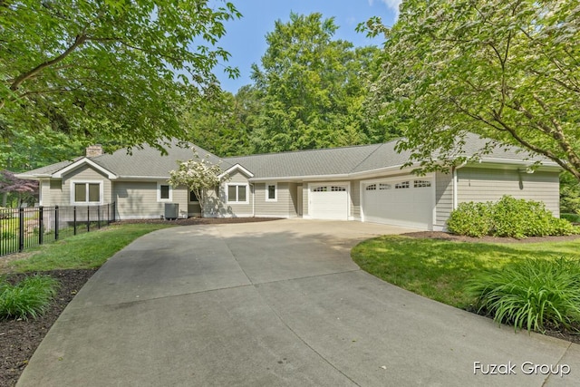 17180 Shore Oaks W Ln, Holland, MI 49424 - single story home featuring an attached garage, concrete driveway, a chimney, and roof with shingles