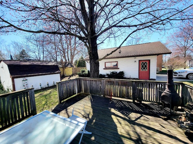 deck featuring an outdoor structure