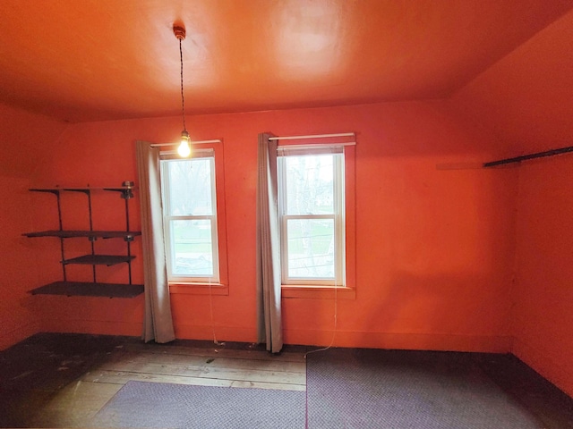 unfurnished dining area featuring wood-type flooring