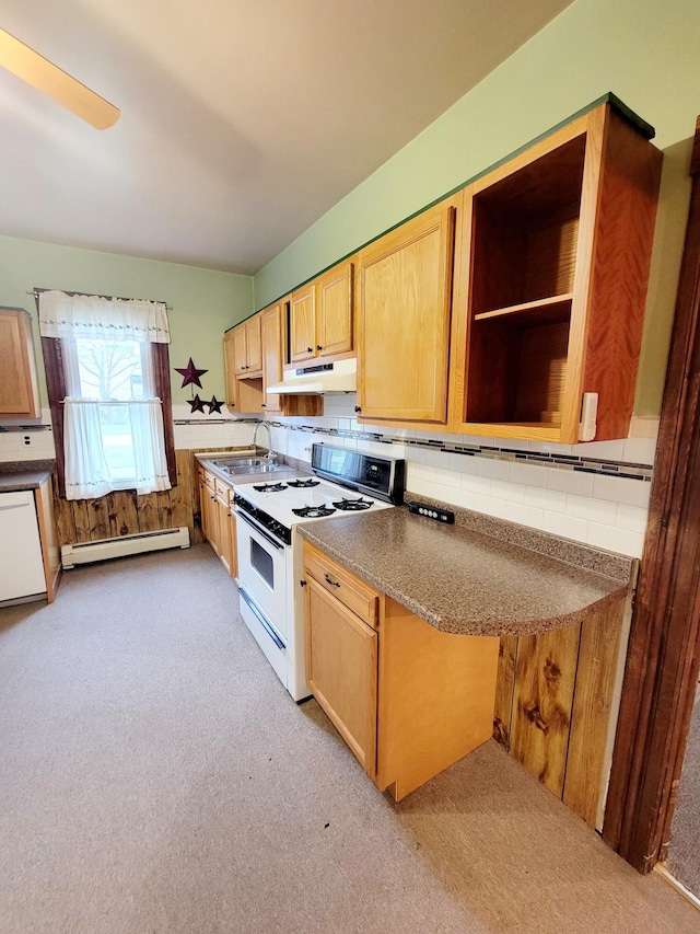 kitchen with a sink, a baseboard radiator, light colored carpet, under cabinet range hood, and white appliances