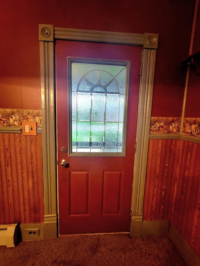 doorway with carpet flooring