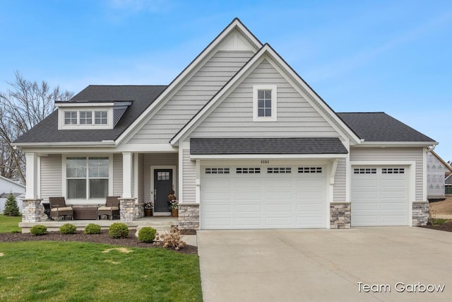 8393 Woodhaven Dr SW Unit 01, Byron Center, MI 49315 - craftsman house with driveway, stone siding, a shingled roof, a porch, and a front yard