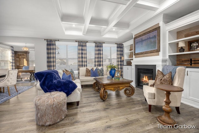 8393 Woodhaven Dr SW Unit 01, Byron Center, MI 49315 - living area with a glass covered fireplace, wood finished floors, a wealth of natural light, and coffered ceiling