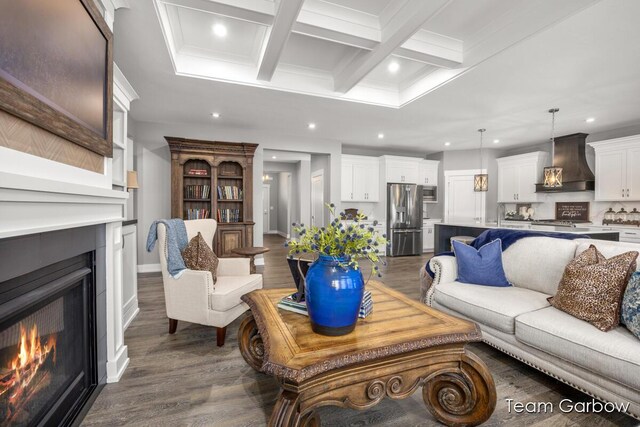 8393 Woodhaven Dr SW Unit 01, Byron Center, MI 49315 - living room featuring a warm lit fireplace, beamed ceiling, coffered ceiling, dark wood-type flooring, and recessed lighting