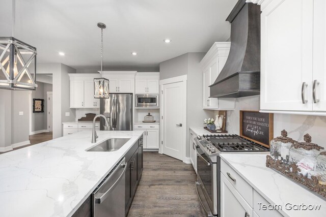 8393 Woodhaven Dr SW Unit 01, Byron Center, MI 49315 - kitchen featuring stainless steel appliances, a sink, white cabinetry, and premium range hood