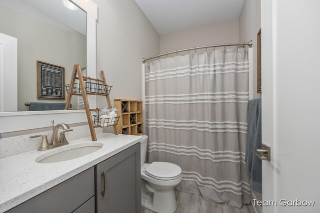 8393 Woodhaven Dr SW Unit 01, Byron Center, MI 49315 - bathroom featuring a shower with shower curtain, toilet, and vanity