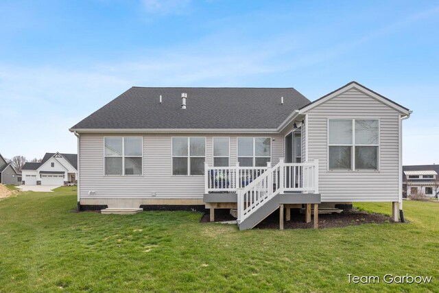 8393 Woodhaven Dr SW Unit 01, Byron Center, MI 49315 - rear view of house featuring a lawn, a shingled roof, and a deck