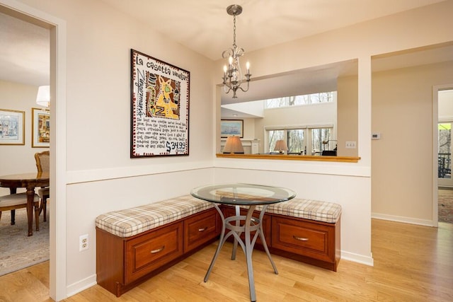 dining room featuring light wood-style flooring, breakfast area, and a wealth of natural light