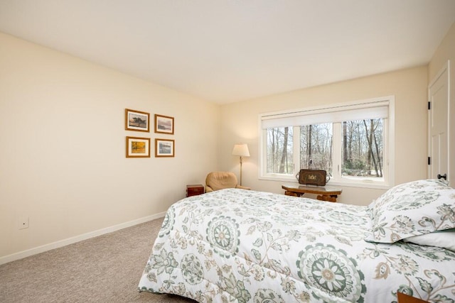carpeted bedroom with baseboards
