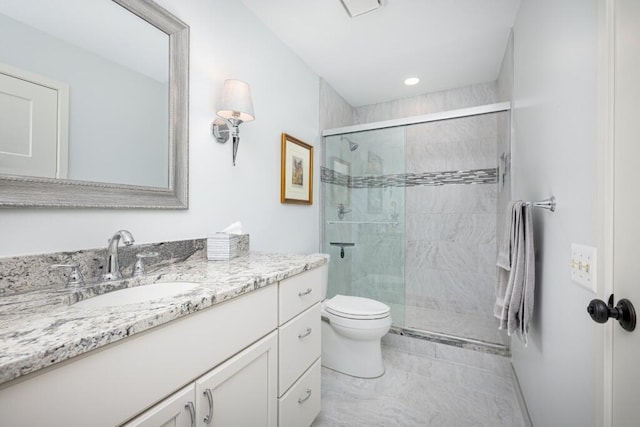 bathroom with toilet, vanity, recessed lighting, and a stall shower