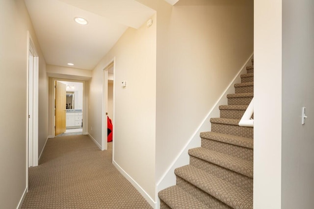 hall with recessed lighting, stairway, baseboards, and carpet