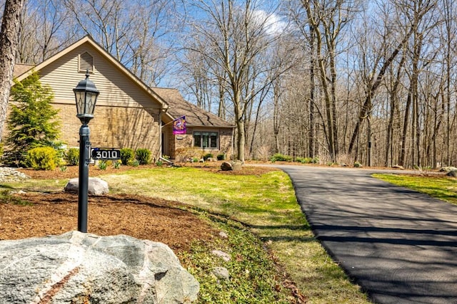 view of front of house featuring brick siding