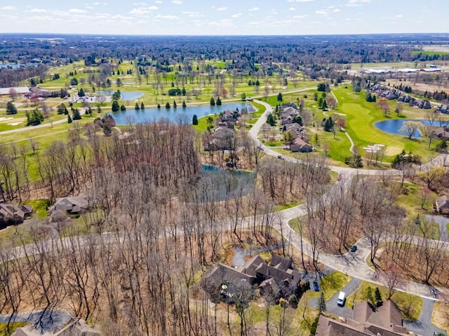 aerial view with view of golf course, a water view, and a residential view