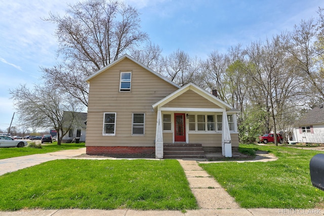 3552 47th St, Hamilton, MI 49419 - traditional-style house with a front lawn and entry steps