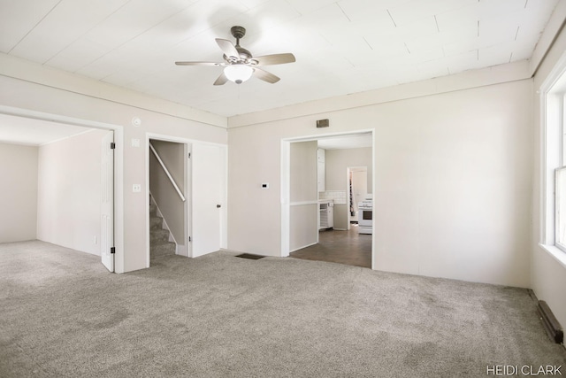 3552 47th St, Hamilton, MI 49419 - carpeted spare room featuring visible vents, stairway, and ceiling fan