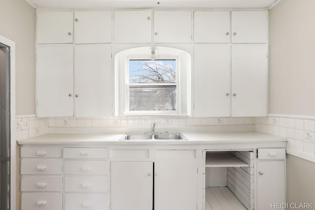 3552 47th St, Hamilton, MI 49419 - kitchen with a sink, white cabinetry, and light countertops