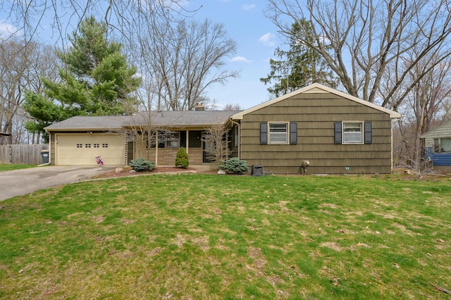 419 Larkspur Ave, Portage, MI 49002 - ranch-style house with an attached garage, driveway, fence, and a front lawn