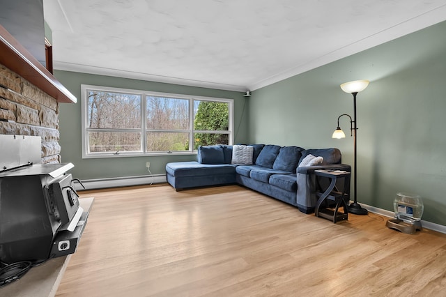 419 Larkspur Ave, Portage, MI 49002 - living room featuring baseboard heating, baseboards, crown molding, and light wood-style floors