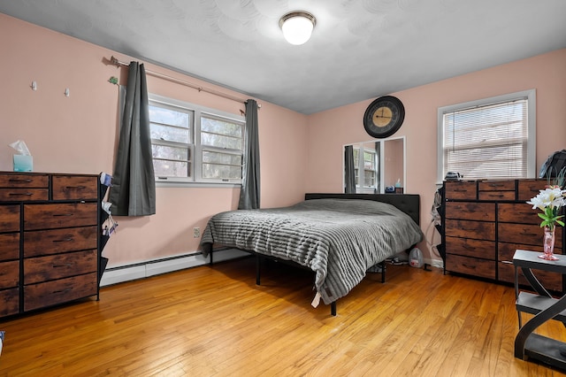 419 Larkspur Ave, Portage, MI 49002 - bedroom featuring wood-type flooring and baseboard heating