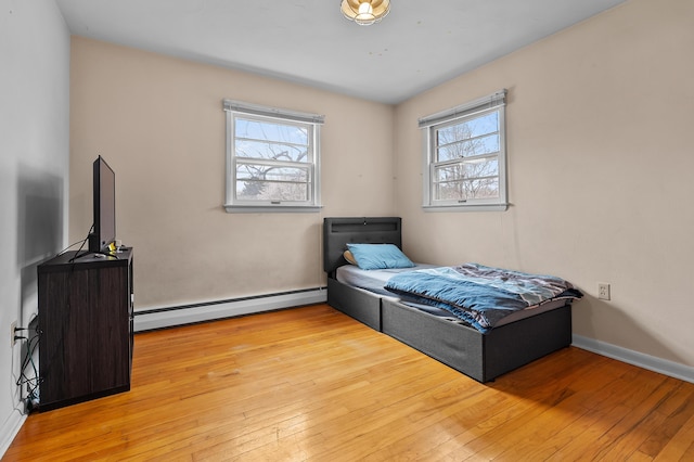 419 Larkspur Ave, Portage, MI 49002 - bedroom with a baseboard heating unit and light wood finished floors