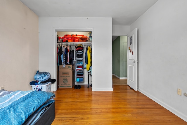 419 Larkspur Ave, Portage, MI 49002 - bedroom featuring light wood finished floors, baseboards, and a closet