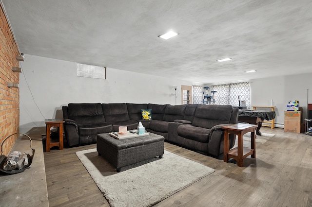 419 Larkspur Ave, Portage, MI 49002 - living room with a baseboard heating unit and wood finished floors