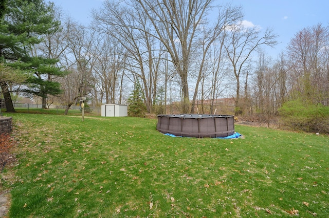 419 Larkspur Ave, Portage, MI 49002 - view of yard featuring fence, an outdoor pool, an outbuilding, and a storage shed